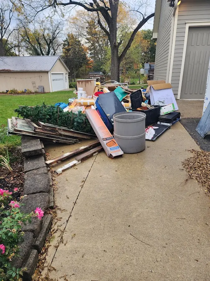 Dumpster being loaded with debris for 3 Yard Dumpster Rental in North Merritt Island